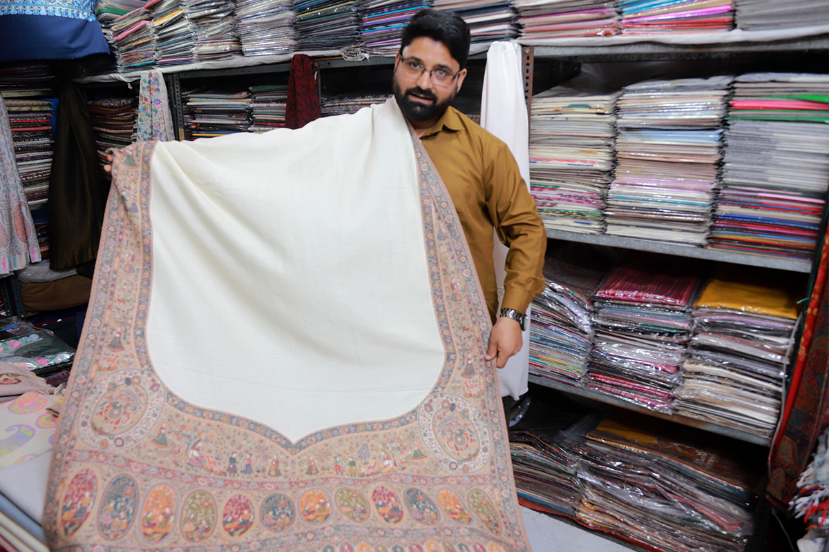  Sofi Farooq, a weaver from Kashmir works here in Delhi haat and sale Pashmina Handloom, Shawls and Stoles (Photo: Sumit Kumar/ The New Indian).