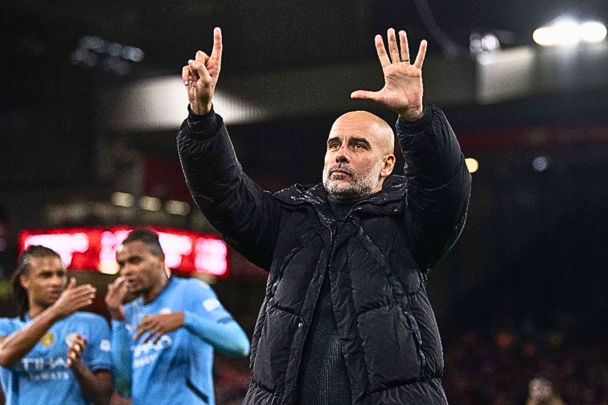 Pep Guardiola reacting to the crowd after defeat against Liverpool.