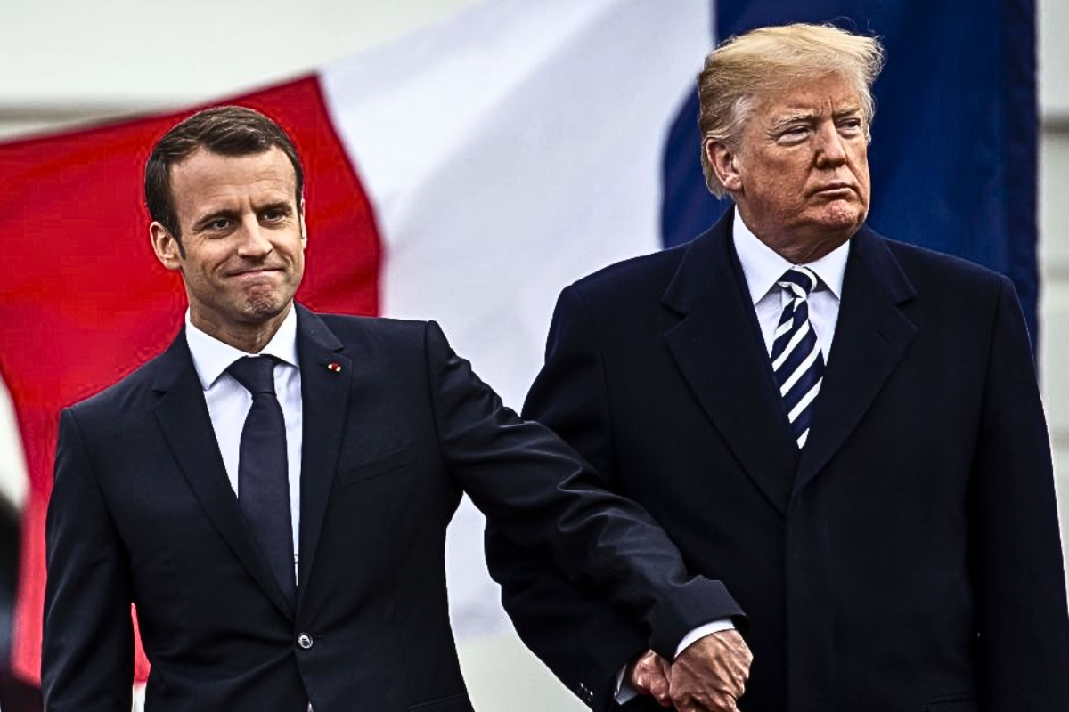 Trump doesn’t leave Macron’s hand; pulls it back.